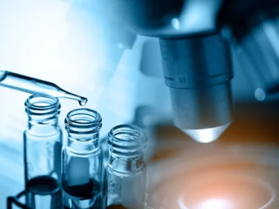 Image of science telescope with pipette putting liquids into tube