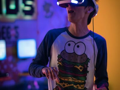 Man playing VR with burger t-shirt on