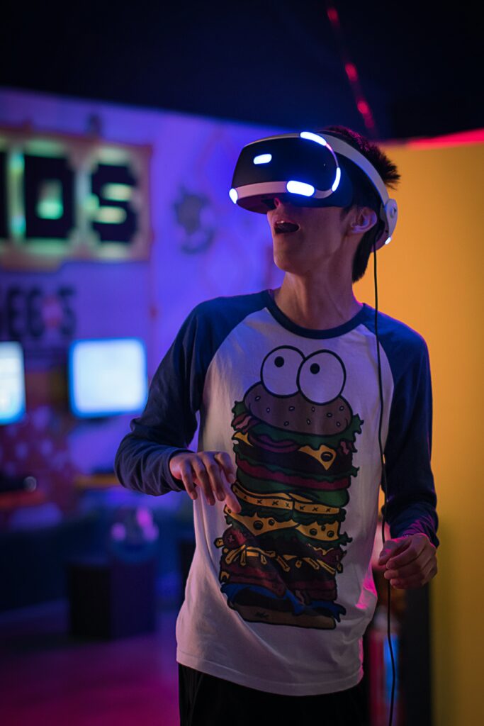 Man playing VR with burger t-shirt on