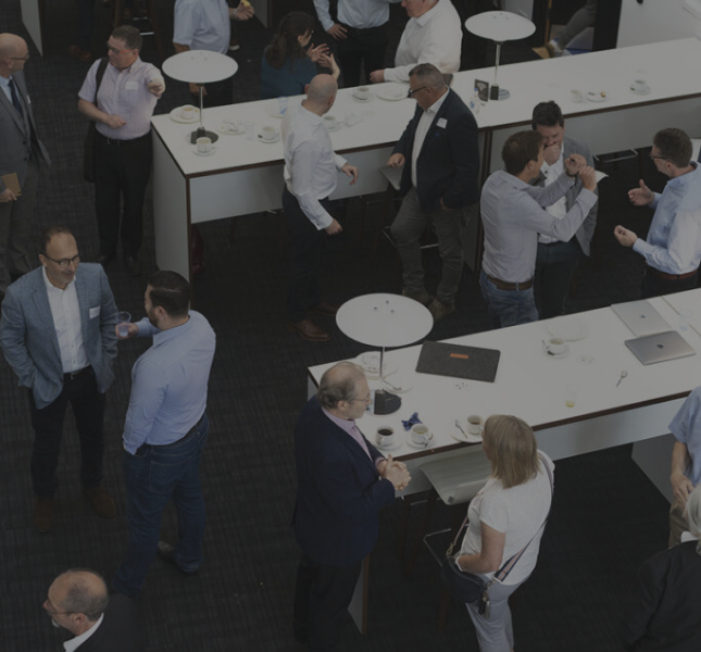 People talking to each other at a networking event